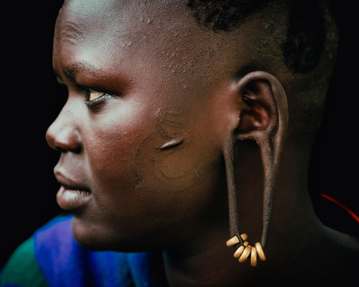 Andrew Eldon Profile of Suri Woman Ear Omo Valey Ethiopia 2023 Courtesy of Blue Lotus Gallery - Tribe Blue Lotus |  - 'TRIBE' at Blue Lotus Gallery Hong Kong