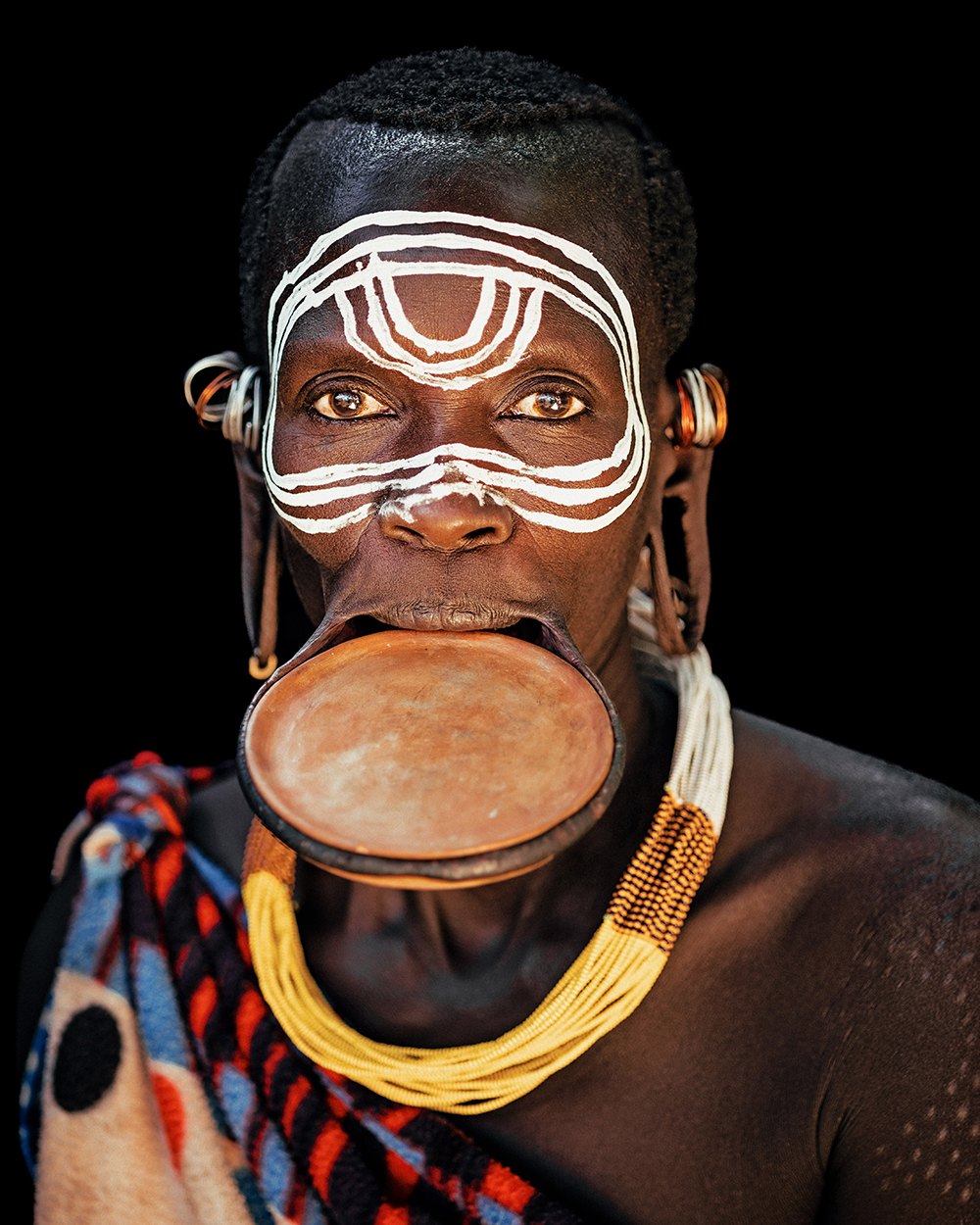 Andrew Eldon Suri Woman with Lip Plate Omo Valey Ethiopia 2023 Courtesy of Blue Lotus Gallery - Tribe Blue Lotus |  - 'TRIBE' at Blue Lotus Gallery Hong Kong