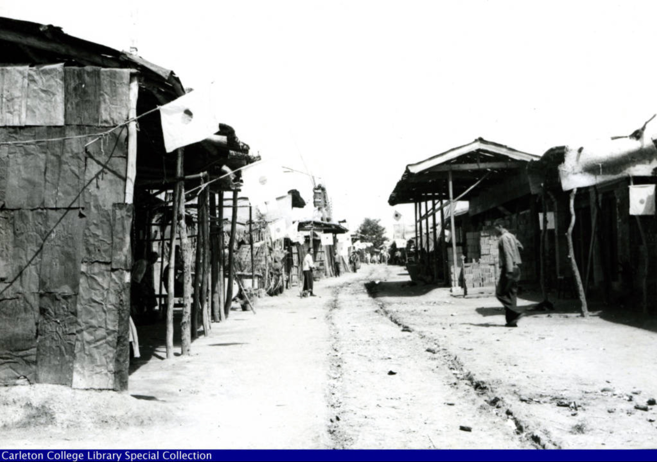Haldore Hanson s China Collection (1937 1938) Japenese flags displayed in Nanyyuan village on July 28 1937 - Haldore Hanson |  - Haldore Hanson